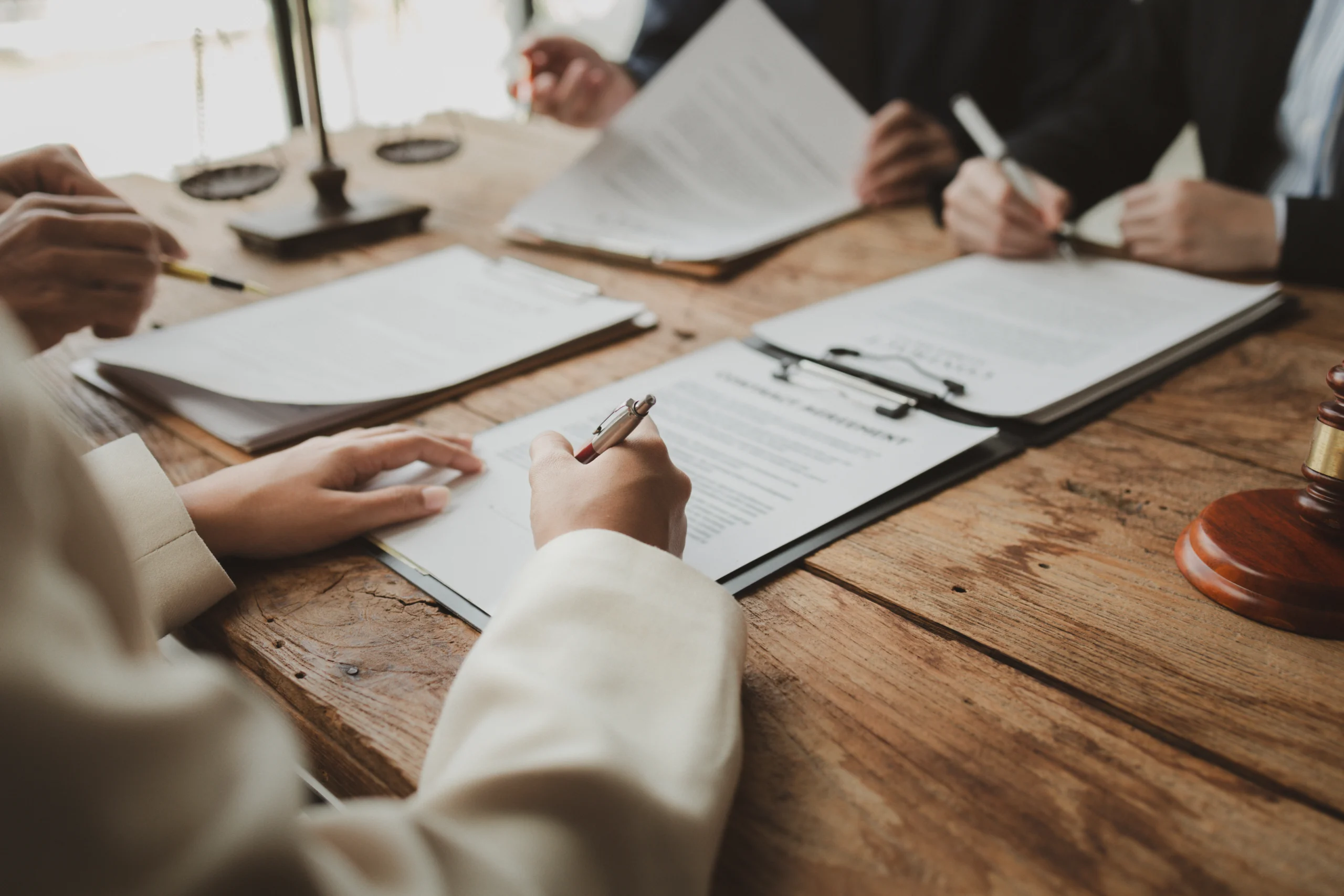 Business people negotiating a contract, discussing contract whil